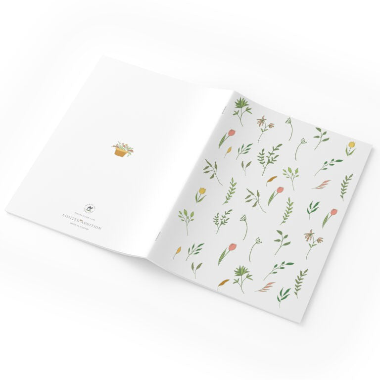 Notebook with floral pattern on a white background