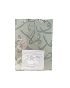 Painted Pad with Arabic calligraphy design on a white background