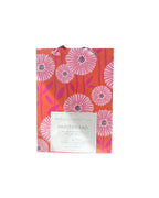 Floral-patterned product packaging on a white background