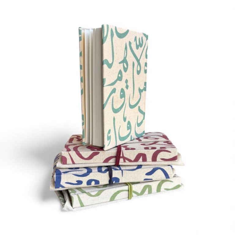 Stack of notebooks with colorful abstract patterns on a white background