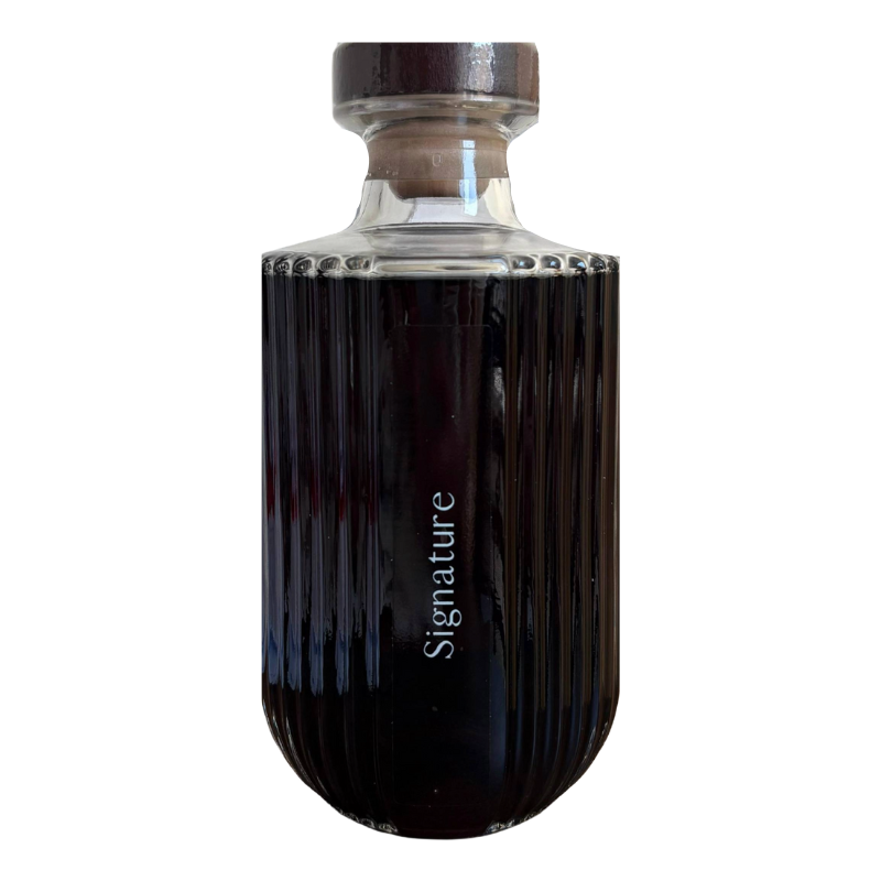 Black bottle with 'Signature' text on a white background