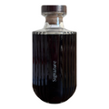 Black bottle with 'Signature' text on a white background
