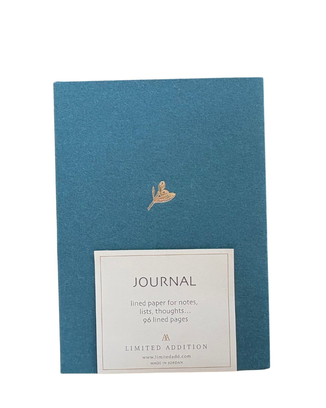 Blue journal with gold embossed design and label on a white background