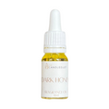 Bottle of Dark Honey fragrance oil with a dropper on a white background