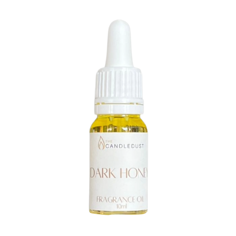 Bottle of Dark Honey fragrance oil with a dropper on a white background