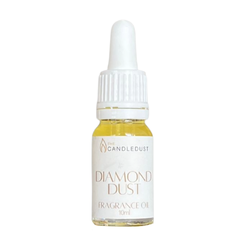Bottle of 'Diamond Dust' fragrance oil with a white dropper on a white background