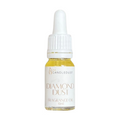 Bottle of 'Diamond Dust' fragrance oil with a white dropper on a white background