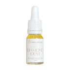 Bottle of 'Diamond Dust' fragrance oil with a white dropper on a white background