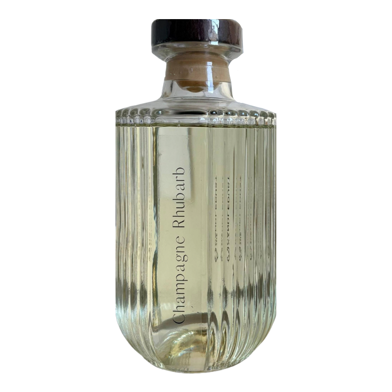 Clear glass bottle with ribbed design and black cap on a white background
