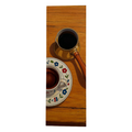 Coffee cup and saucer with floral design on a wooden surface