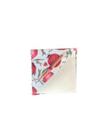 Folded fabric with pomegranate pattern on a white background