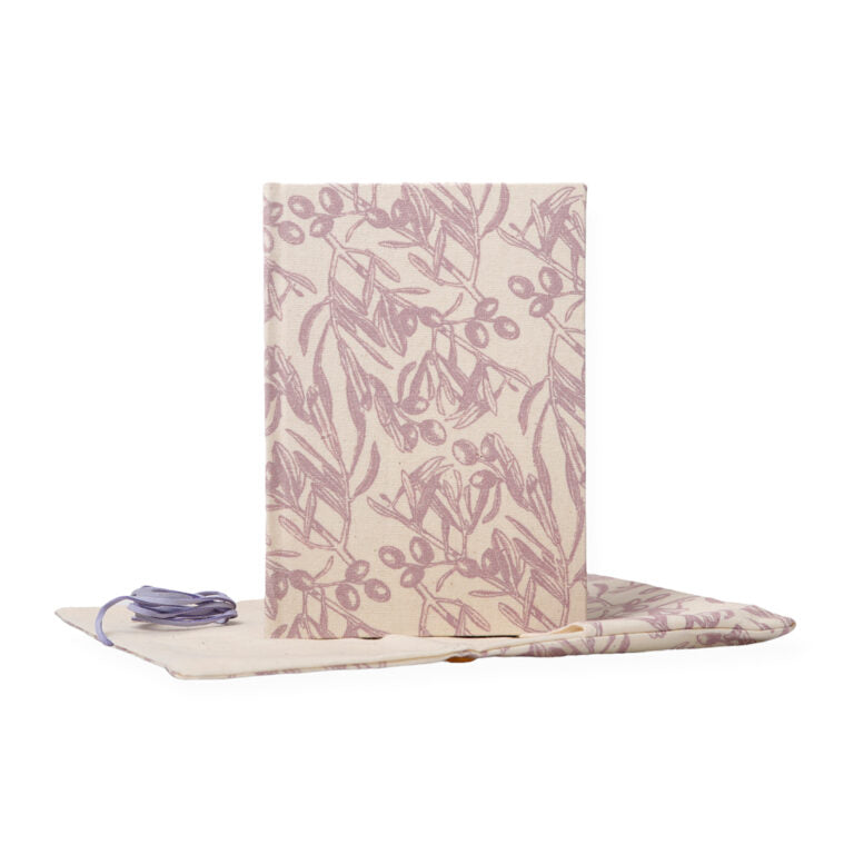 Floral-patterned mat with a strap on a white background