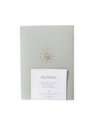 Journal with a spiral design on a light gray background