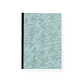 Notebook with a leaf pattern on a light blue background