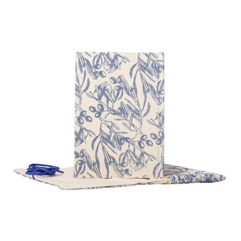 Folded fabric with blue floral pattern on a white background