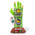 Toy figure of a green monster hand with a packaging label on a white background