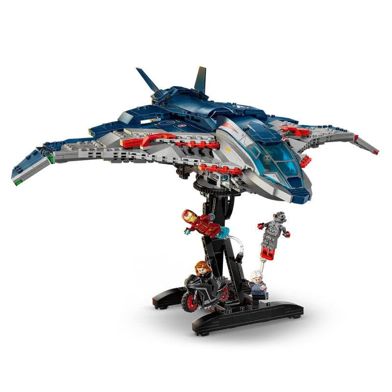 Toy spaceship model with figures on a white background