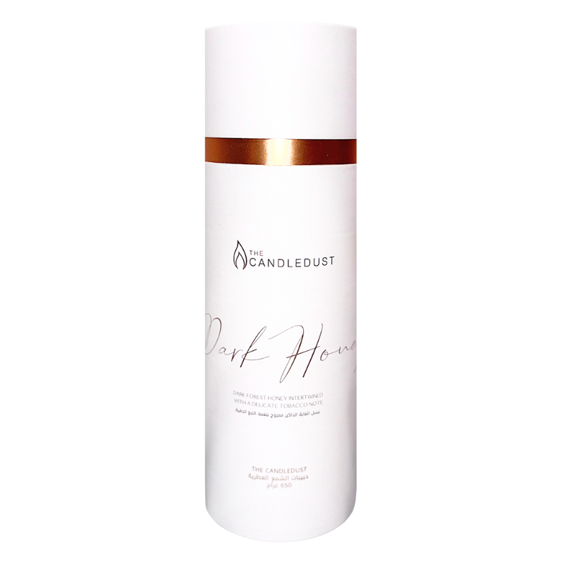 White bottle with gold band and 'Candle Dust' branding on a white background
