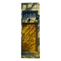 Wooden door with decorative ironwork on a stone wall