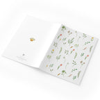 Notebook with floral pattern on a white background
