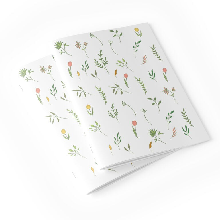 Notebook with floral pattern on a white background